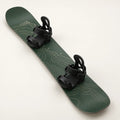 Forest-green Alpine 156 snowboard with cream contour graphics and black bindings, shown at a three-quarter angle